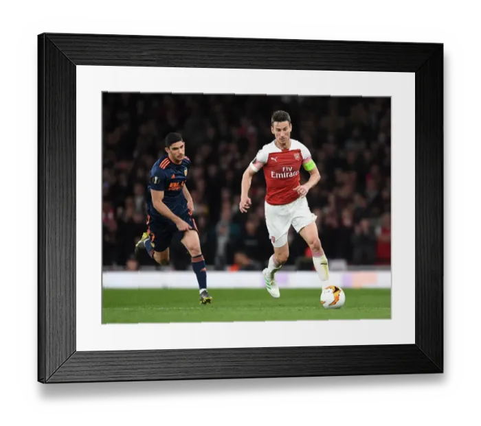 Framed Print : Arsenal's Koscielny Battles Past Valencia's Guedes in UEFA Europa League Semi-Final Showdown Framed Print : Arsenal's Koscielny Battles Past Valencia's Guedes in UEFA Europa League Semi-Final Showdown
