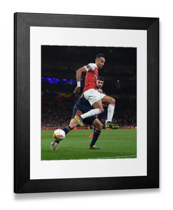 Framed Print : Aubameyang vs Piccini: Intense Battle in Arsenal's Europa League Semi-Final Clash with Valencia Framed Print : Aubameyang vs Piccini: Intense Battle in Arsenal's Europa League Semi-Final Clash with Valencia