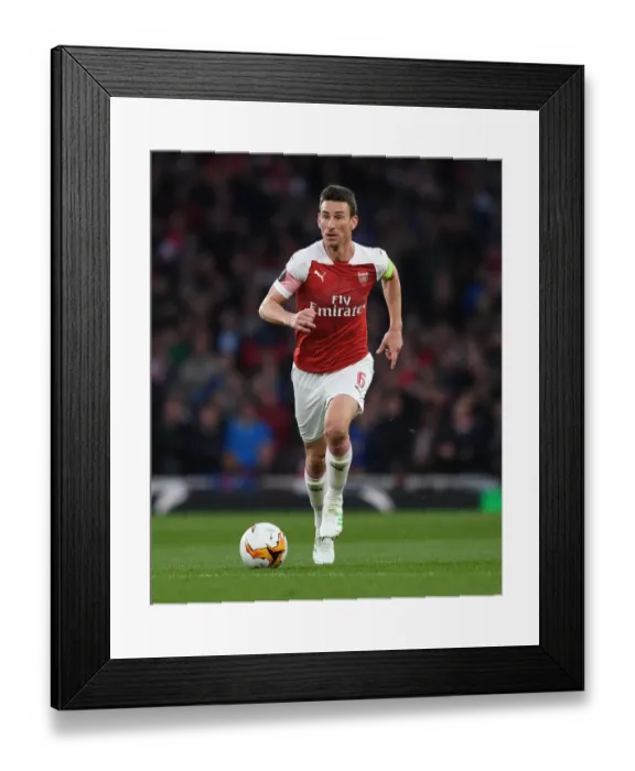 Framed Print : Arsenal's Laurent Koscielny Focuses in UEFA Europa League Semi-Final vs Valencia