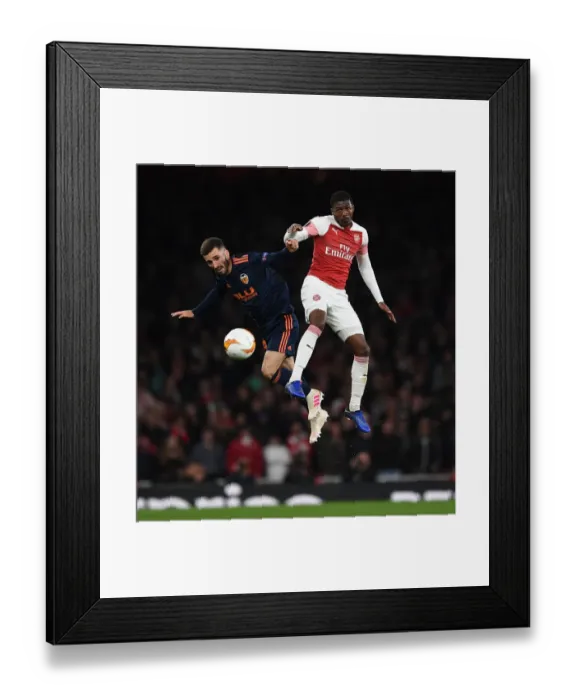 Framed Print : Arsenal vs Valencia: Ainsley Maitland-Niles vs Jose Gaya - UEFA Europa League Semi-Final Clash Framed Print : Arsenal vs Valencia: Ainsley Maitland-Niles vs Jose Gaya - UEFA Europa League Semi-Final Clash
