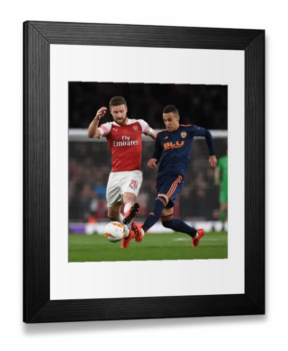 Framed Print : Arsenal vs Valencia: Mustafi Closes In on Rodrigo in Europa League Semi-Final Showdown Framed Print : Arsenal vs Valencia: Mustafi Closes In on Rodrigo in Europa League Semi-Final Showdown