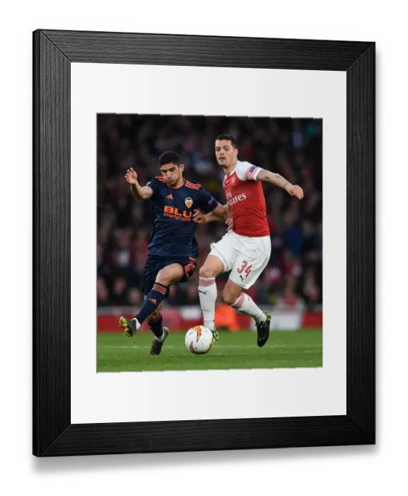 Framed Print : Arsenal vs Valencia: Xhaka vs Guedes - UEFA Europa League Semi-Final Showdown