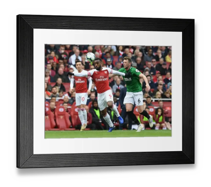 Framed Print : Arsenal's Alexandre Lacazette Faces Off Against Brighton's Dale Stephens in Premier League Showdown