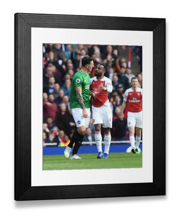 Framed Print : Arsenal's Lacazette and Dunk in Deep Conversation During Arsenal v Brighton Match