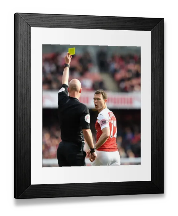 Framed Print : Arsenal's Stephan Lichtsteiner Shown Yellow Card by Referee Anthony Taylor vs. Brighton & Hove Albion