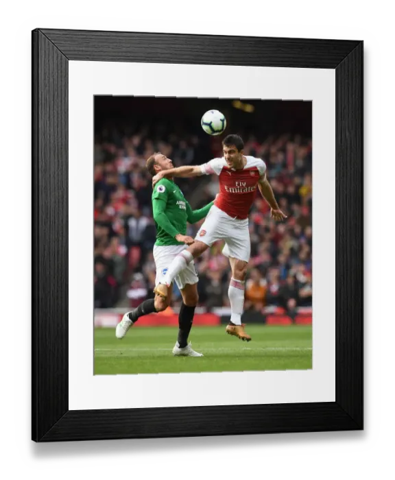 Framed Print : Sokratis vs Murray: Intense Heading Battle at Arsenal vs Brighton Premier League Match