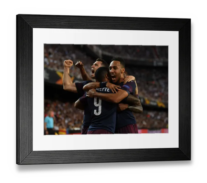 Framed Print : United in Victory: Aubameyang, Lacazette, and Xhaka's Triumphant Goal Celebration in Arsenal's Europa League Semi-Final Win over Valencia