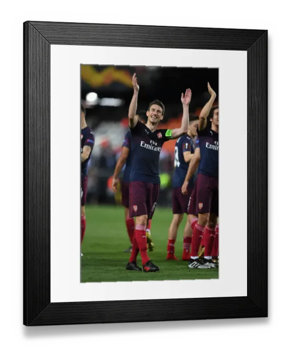 Framed Print : Arsenal's Laurent Koscielny Celebrates with Fans after UEFA Europa League Semi-Final Second Leg against Valencia