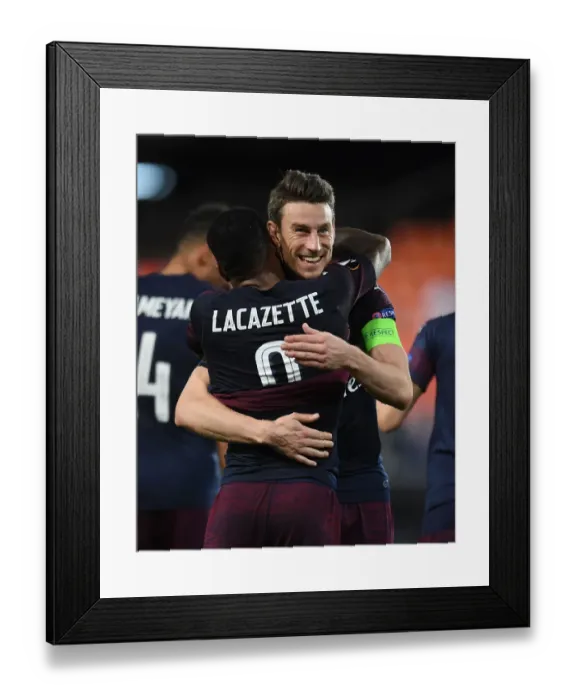 Framed Print : Arsenal's Emotional Reunion: Lacazette and Koscielny's Heartfelt Hug in Europa League Semifinal Framed Print : Arsenal's Emotional Reunion: Lacazette and Koscielny's Heartfelt Hug in Europa League Semifinal