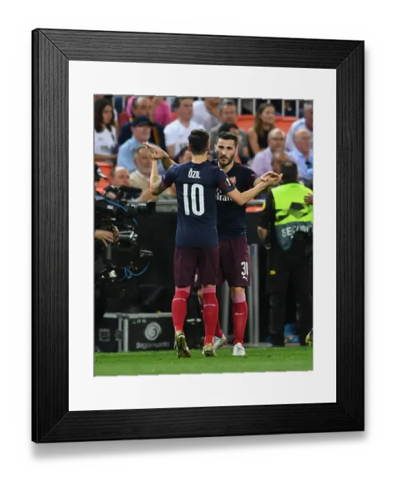 Framed Print : Arsenal Celebrates Double Strike: Valencia vs Arsenal - UEFA Europa League Semi-Final (2018-19)