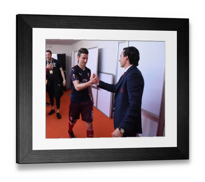 Framed Print : Unai Emery Congratulates Koscielny: Arsenal Secure Europa League Final Spot vs. Valencia