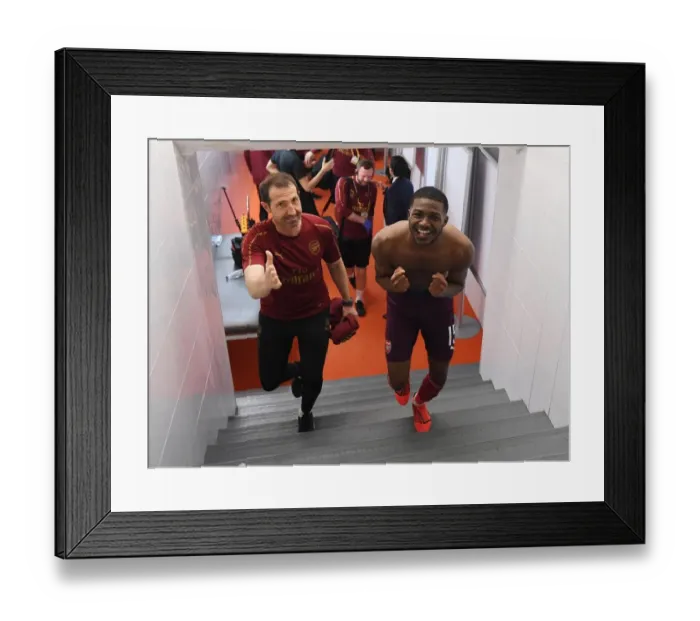 Framed Print : Ainsley Maitland-Niles and Julen Masach: Arsenal's Europa League Semi-Final Victory Celebration (Valencia, 2019)