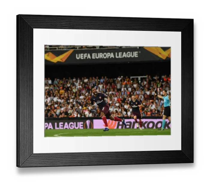 Framed Print : Alexis Lacazette's Brace: Arsenal Secures Semi-Final Victory over Valencia in Europa League