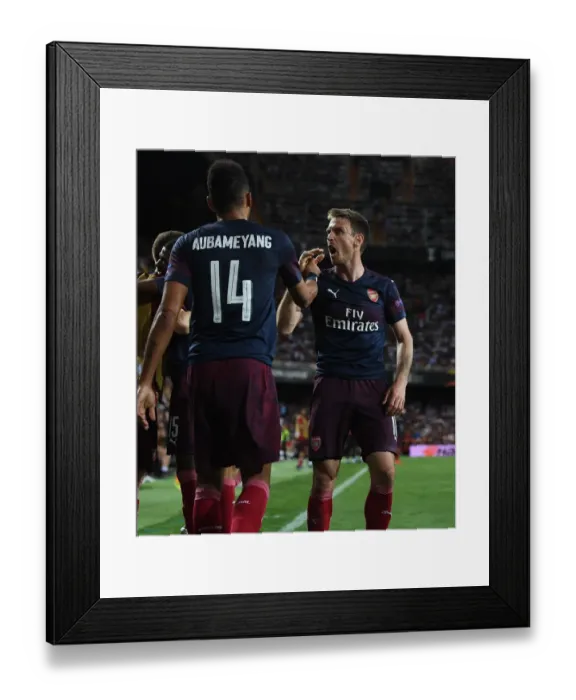 Framed Print : Arsenal's Aubameyang and Monreal Celebrate Goal in Europa League Semi-Final vs Valencia Framed Print : Arsenal's Aubameyang and Monreal Celebrate Goal in Europa League Semi-Final vs Valencia