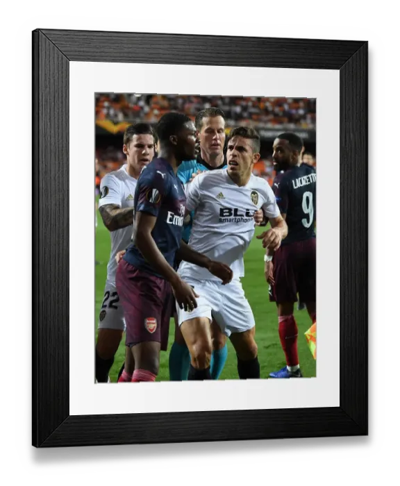 Framed Print : Arsenal vs Valencia: Europa League Semi-Final Clash - Ainsley Maitland-Niles vs Gabriel