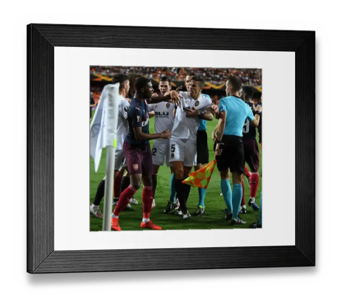 Framed Print : Clash of Giants: Ainsley Maitland-Niles vs. Gabriel in the Intense UEFA Europa League Semi-Final Showdown between Valencia and Arsenal Framed Print : Clash of Giants: Ainsley Maitland-Niles vs. Gabriel in the Intense UEFA Europa League Semi-Final Showdown between Valencia and Arsenal