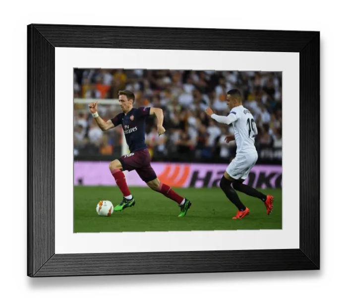 Framed Print : Nacho Monreal Breaks Past Rodrigo in Arsenal's UEFA Europa League Semi-Final Showdown vs Valencia Framed Print : Nacho Monreal Breaks Past Rodrigo in Arsenal's UEFA Europa League Semi-Final Showdown vs Valencia