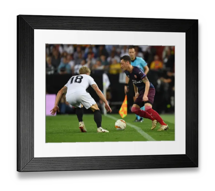 Framed Print : Mesut Ozil vs. Daniel Wass: Arsenal's Europa League Semi-Final Battle at Valencia