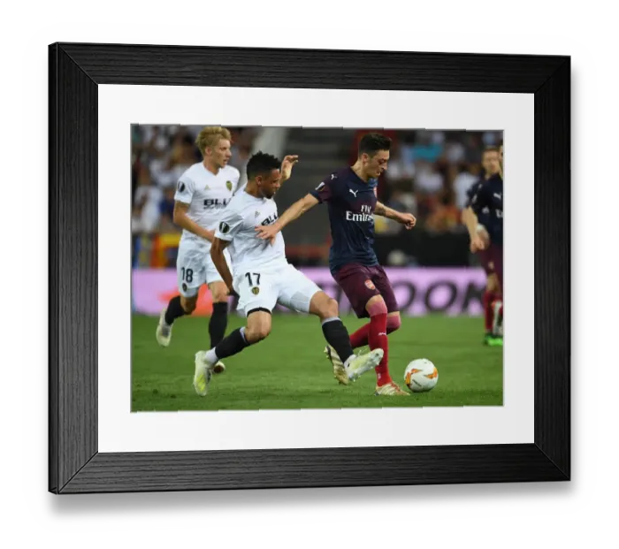 Framed Print : Mesut Ozil vs. Francis Coquelin: Clash in Arsenal's Europa League Semi-Final Showdown against Valencia