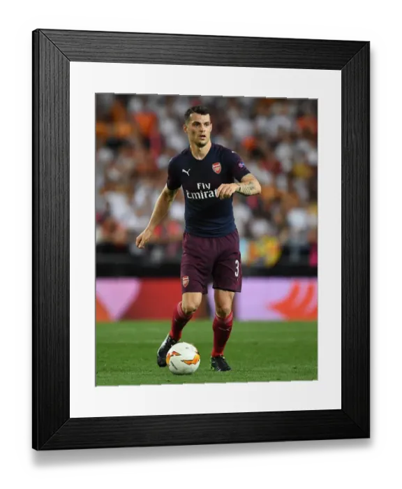 Framed Print : Granit Xhaka in Action: Arsenal's Europa League Showdown vs Valencia Framed Print : Granit Xhaka in Action: Arsenal's Europa League Showdown vs Valencia