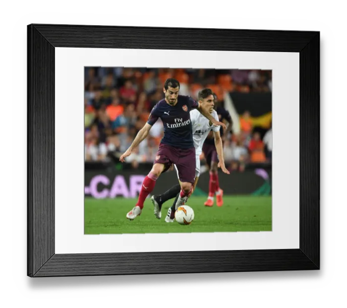 Framed Print : Arsenal's Mkhitaryan Outmaneuvers Valencia's Gabriel in Europa League Semi-Final Showdown