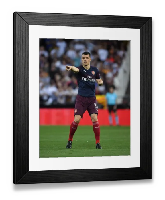 Framed Print : Granit Xhaka in Action: Arsenal vs Valencia, UEFA Europa League Semi-Final (2018-19)