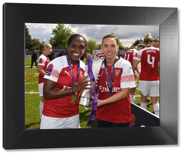 Arsenal Women Celebrate WSL Title: Danielle Carter and Jordan Nobbs Hold the Trophy