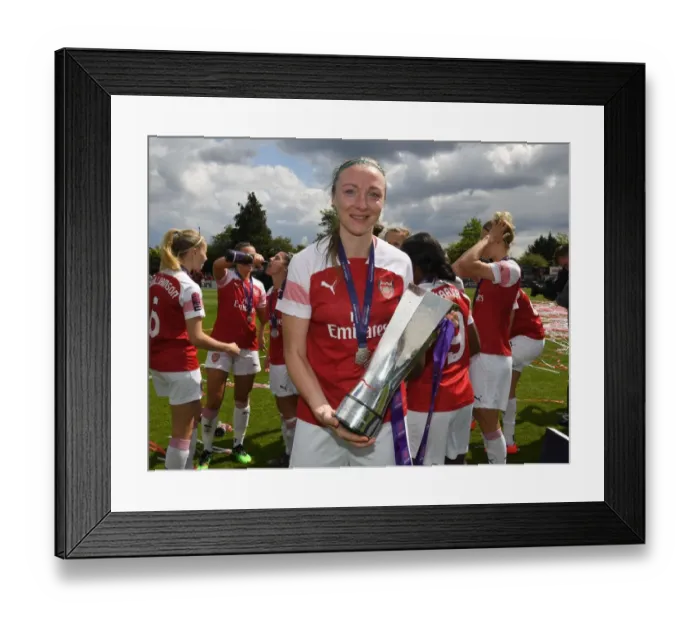 Framed Print : Louise Quinn Lifts WSL Trophy: Arsenal Women Celebrate Championship Win over Manchester City Women