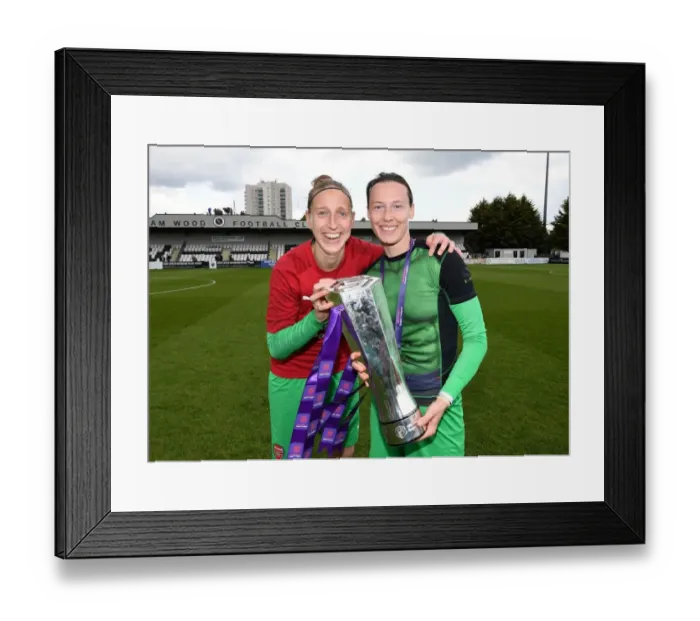 Framed Print : Arsenal Women Celebrate WSL Title Triumph: Sari van Veenendaal and Pauline Peyraud-Magnin Hold the Trophy