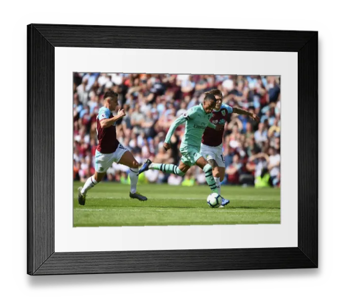 Framed Print : Joe Willock's Thrilling Run: Arsenal's Midfielder Surges Past Burnley's Defense in Premier League Clash