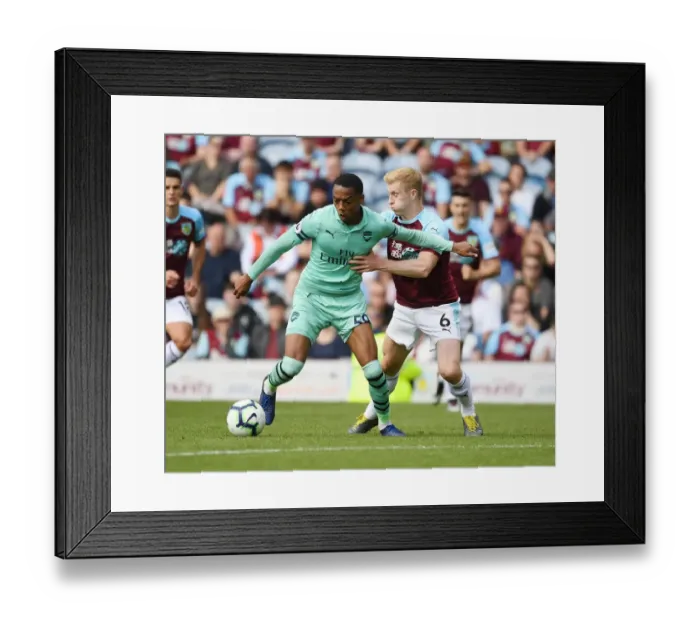 Framed Print : Burnley vs Arsenal: Joe Willock Clashes with Ben Mee in Intense Premier League Showdown