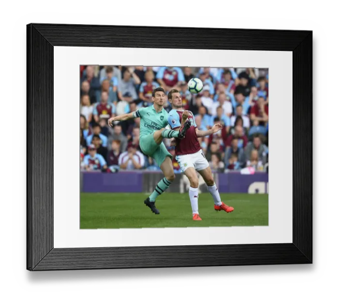 Framed Print : Clash at Turf Moor: Koscielny vs. Wood in Burnley vs. Arsenal Premier League Showdown Framed Print : Clash at Turf Moor: Koscielny vs. Wood in Burnley vs. Arsenal Premier League Showdown