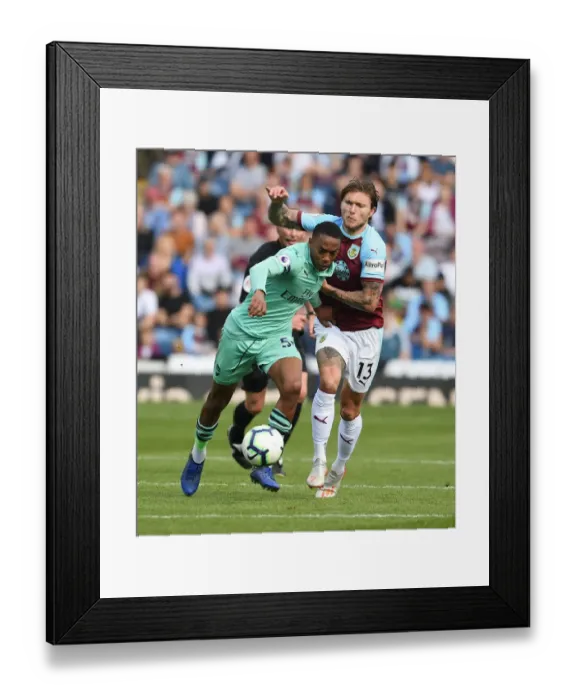 Framed Print : Clash at Turf Moor: A Football Battle Between Joe Willock and Jeff Hendrick