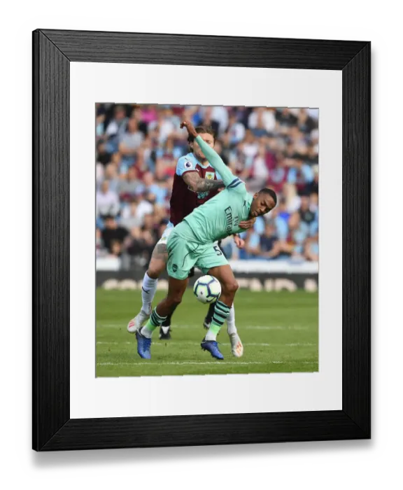 Framed Print : Clash at Turf Moor: Burnley vs. Arsenal - Premier League Showdown (2018-19) - Intense Battle between Joe Willock and Jeff Hendrick Framed Print : Clash at Turf Moor: Burnley vs. Arsenal - Premier League Showdown (2018-19) - Intense Battle between Joe Willock and Jeff Hendrick