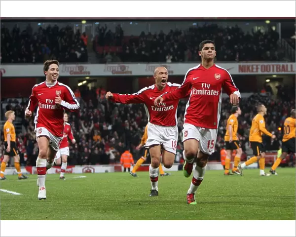 Denilson celebrates scoring Arsenals 1st goal with Mikael Silvestre and Samir Nasri