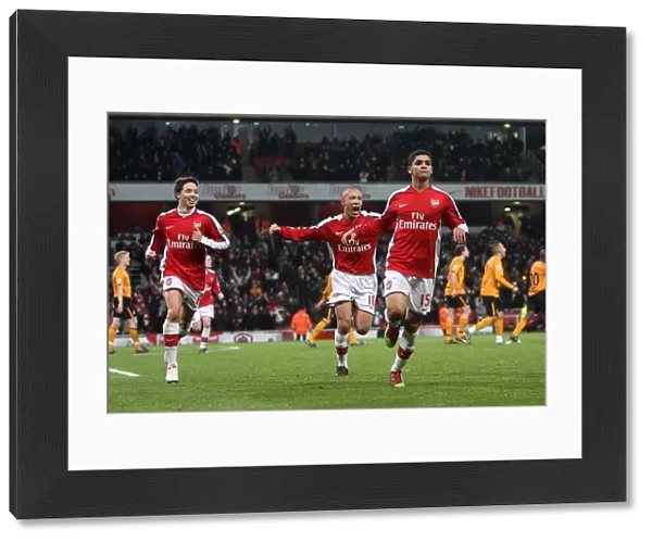 Denilson celebrates scoring Arsenals 1st goal with Mikael Silvestre and Samir Nasri