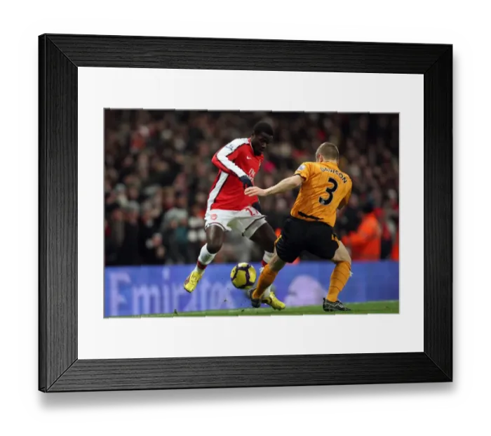 Framed Print : Emmanuel Eboue (Arsenal) Andy Dawson (Hull). Arsenal 3: 0 Hull City. Barclays Premier League