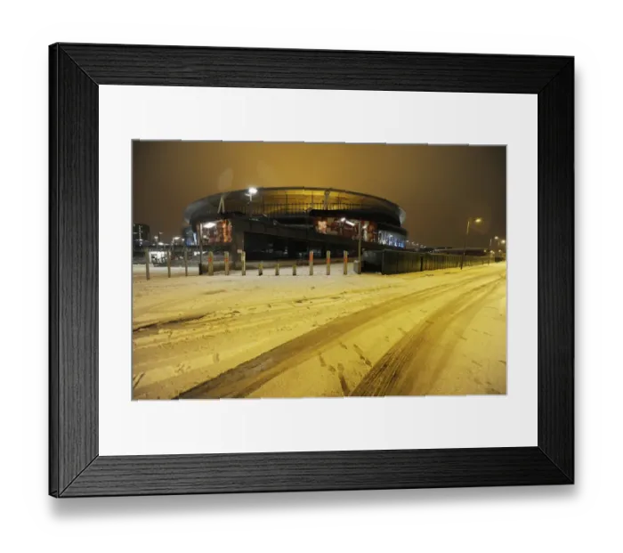 Framed Print : Winter's Embrace at Emirates: Arsenal Football Club under Snow