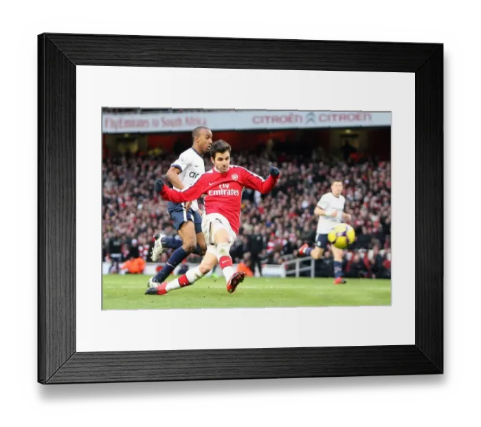 Framed Print : Cesc Fabregas scores his and Arsenals 2nd goal under pressure from Fabian Delph