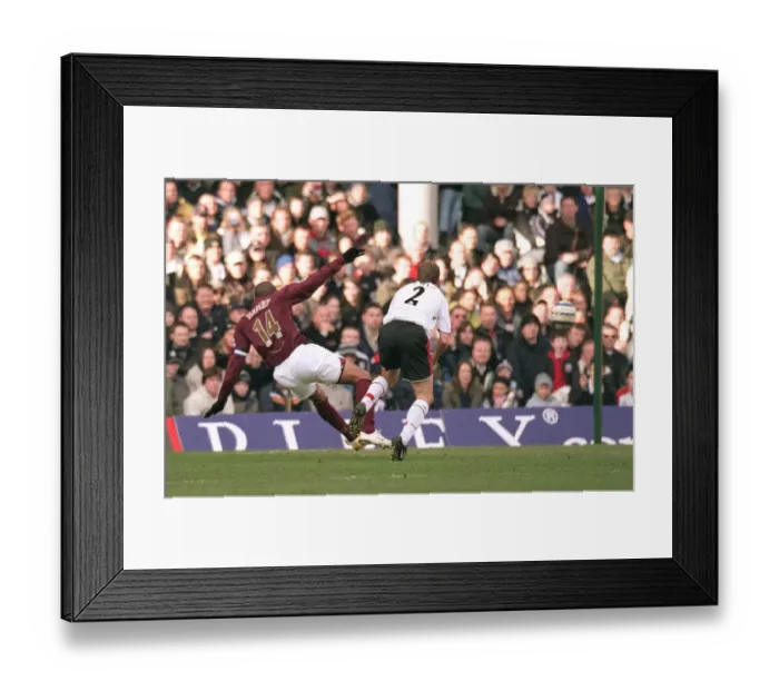 Framed Print : Thierry Henry scores Arsenals 1st goal under pressure from Moritz Volz (Fulham) Framed Print : Thierry Henry scores Arsenals 1st goal under pressure from Moritz Volz (Fulham)