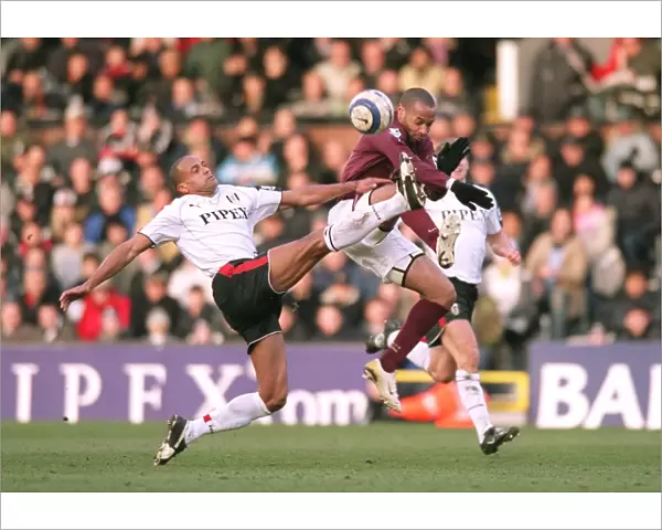 Thierry Henry (Arsenal) Alain Goma (Fulham). Fulham 0: 4 Arsenal. FA Premiership