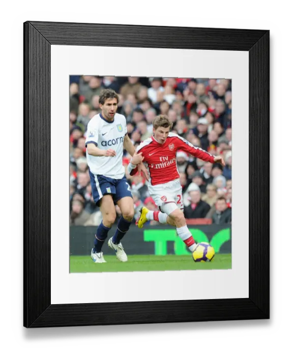 Framed Print : Andrey Arshavin (Arsenal) Carlos Cuellar (Aston Villa). Arsenal 3: 0 Aston Villa Framed Print : Andrey Arshavin (Arsenal) Carlos Cuellar (Aston Villa). Arsenal 3: 0 Aston Villa