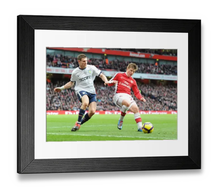 Framed Print : Andrey Arshavin (Arsenal) James Milner (Aston Villa). Arsenal 3: 0 Aston Villa