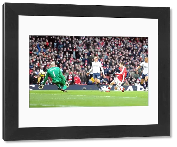 Cesc Fabregas shoots past Aston Villa goalkeeper Brad Friedel to score the 2nd Arsenal goal