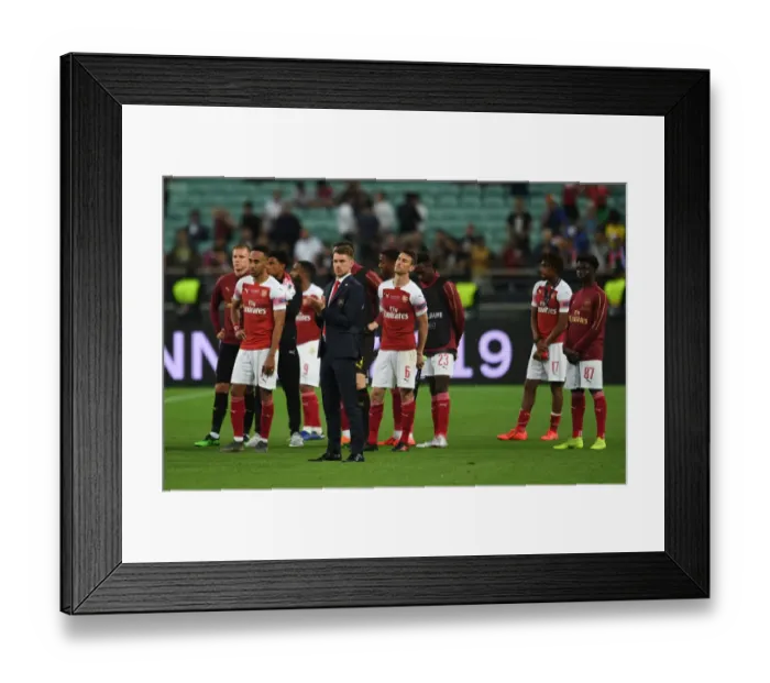 Framed Print : Aaron Ramsey's Triumphant Europa League Celebration: Arsenal Overpowers Chelsea in Baku