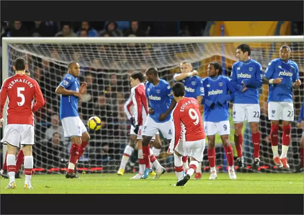 Eduardo shoots past the Portsmouth wall to score the 1st Arsenal goal. Portsmouth 1