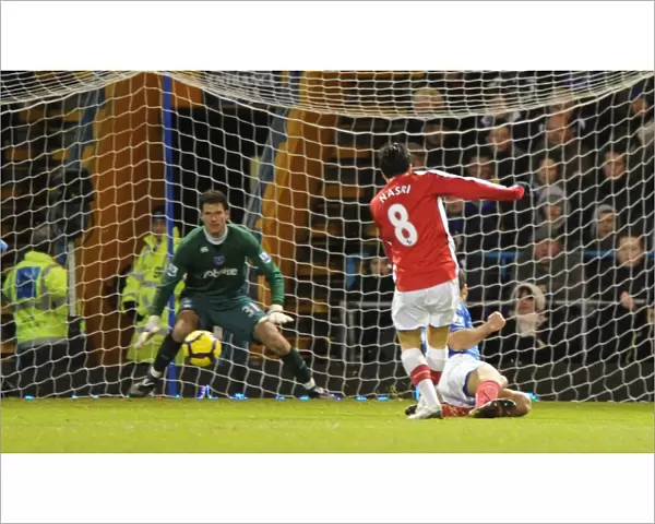 Samir Nasri shoots past Portsmouth goalkeeper Asmir Begovic to score the 2nd Arsenal goal