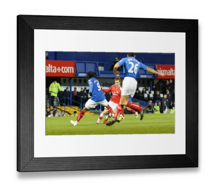 Framed Print : Aaron Ramsey breaks past Frederic Piquionne to score the 3rd Arsenal goal Framed Print : Aaron Ramsey breaks past Frederic Piquionne to score the 3rd Arsenal goal