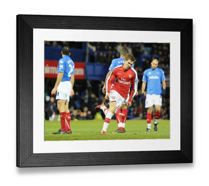 Framed Print : Aaron Ramsey's Triumph: The Thrilling Moment of Arsenal's 3-1 Victory Over Portsmouth
