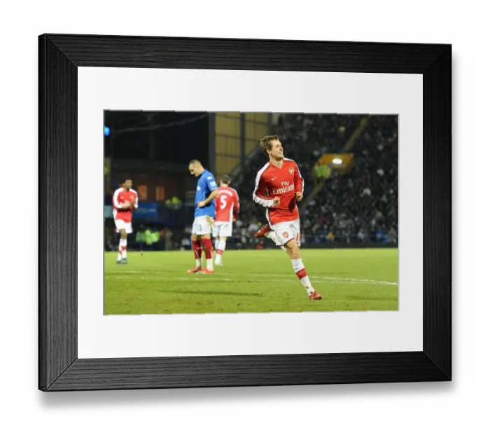 Framed Print : Aaron Ramsey's Triumphant Goal: Arsenal Crushes Portsmouth 4-1 in Premier League Framed Print : Aaron Ramsey's Triumphant Goal: Arsenal Crushes Portsmouth 4-1 in Premier League